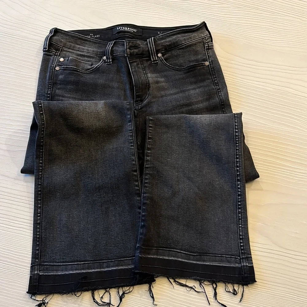 Distressed black Liverpool jean.
